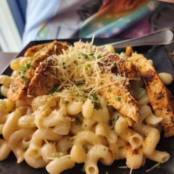 Fort Myers signature dishes PB&J Burger, Tot-chos (tater tot nachos), Mac and Cheese, Craft Cocktails